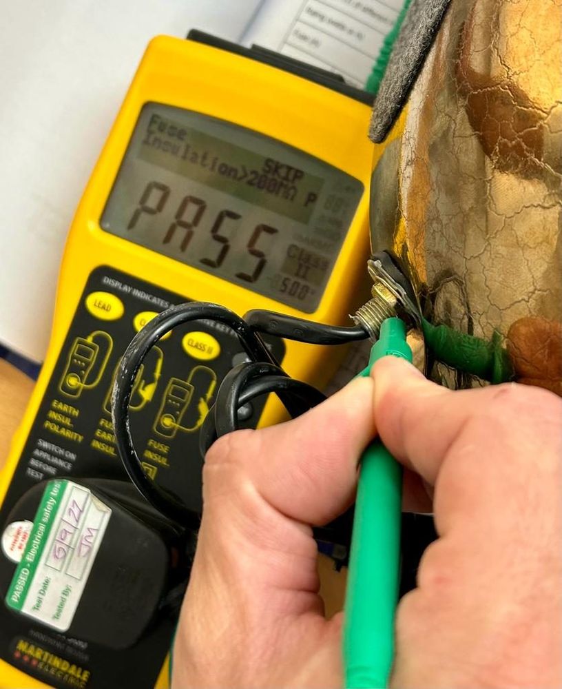 Learner using a PAT tester in class